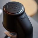Black PuqPress PRO with 'PUQ' branding on a blurred background