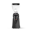 A professional coffee grinder with a matte black base, a clear hopper, and a black top lid, shown on a solid white background.