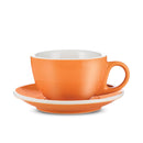 Side view of orange cappuccino cup with white interior