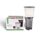 Toddy Essential Brewer standing upright beside green and white packaging for home cold brew