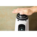 Hand pressing retention collar on white AllGround ProBrew coffee grinder