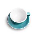 Angled top-down view of teal Loveramics egg cappuccino set on saucer