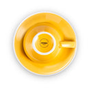 yellow egg shaped cappuccino cup and saucer