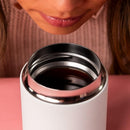 Close-up of white ceramic-coated interior rim on Fellow Carter Wide coffee mug