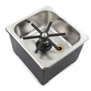 High-angle shot of rinser showing black spray nozzle and brass drain fitting