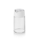 Front view of empty OXO glass creamer with white lid