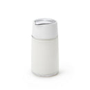 Closed OXO Good Grips creamer dispenser filled with milk