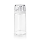 Empty OXO glass creamer with brushed stainless steel cap