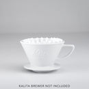 White ceramic Kalita Wave dripper with inserted 185 paper filter and embossed logo