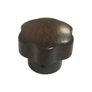La Pavoni wooden steam valve knob with scalloped flower edge and visible wood grain
