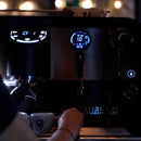 Sanremo F18SB white espresso machine pouring shot with illuminated digital display