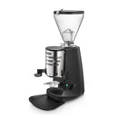 Mazzer Super Jolly V Up manual espresso grinder with black housing, stainless steel doser, and conical hopper
