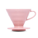 Front view of pink Hario V60 ceramic dripper with handle and saucer