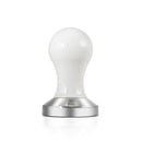 Close-up of Compressore 57mm convex tamper highlighting glossy white handle and branded metal base